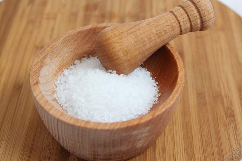 Salt in a wooden mortar and pestle