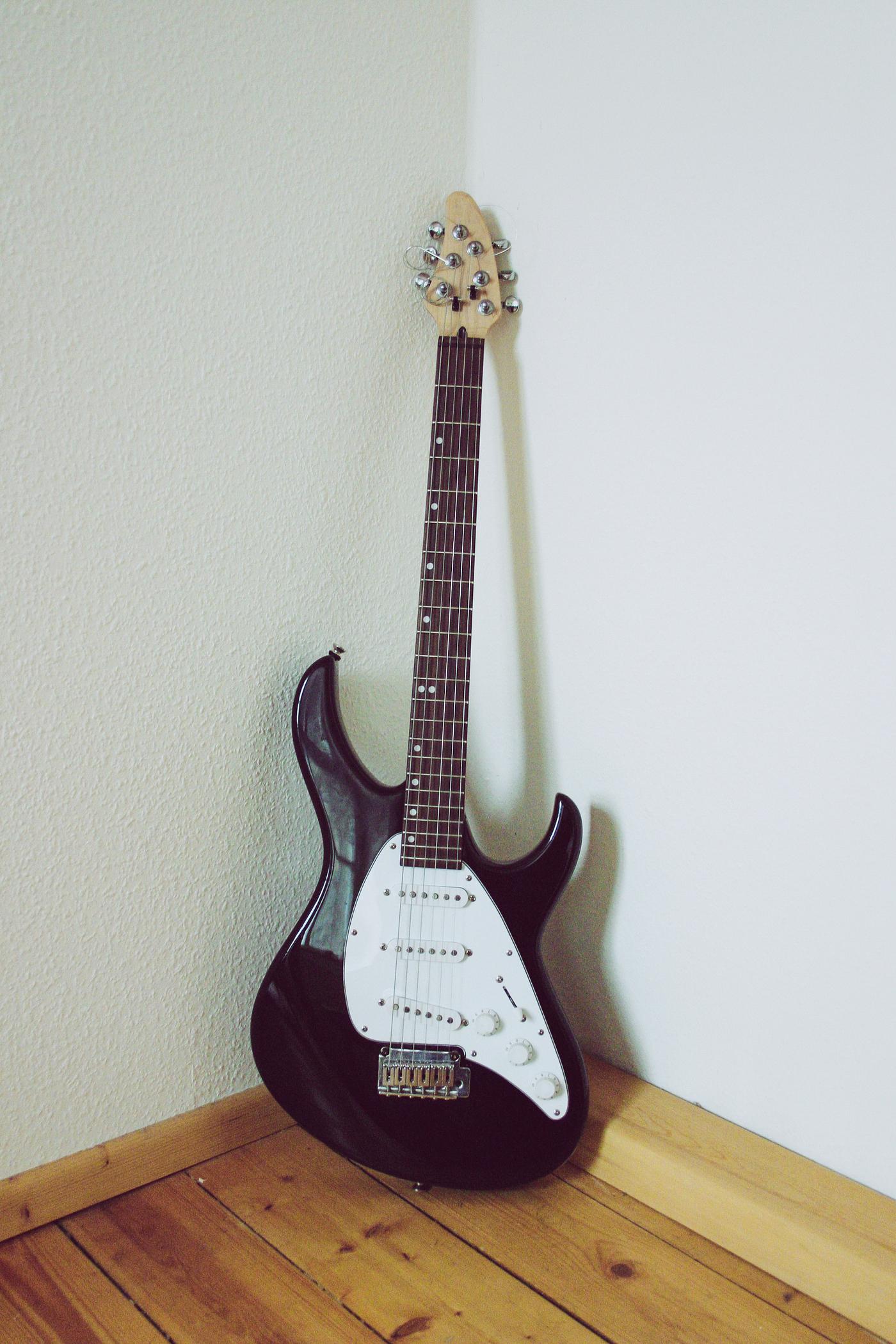 Musical instrument electric guitar leaning on the wall Musical instrument electric guitar leaning on the wall