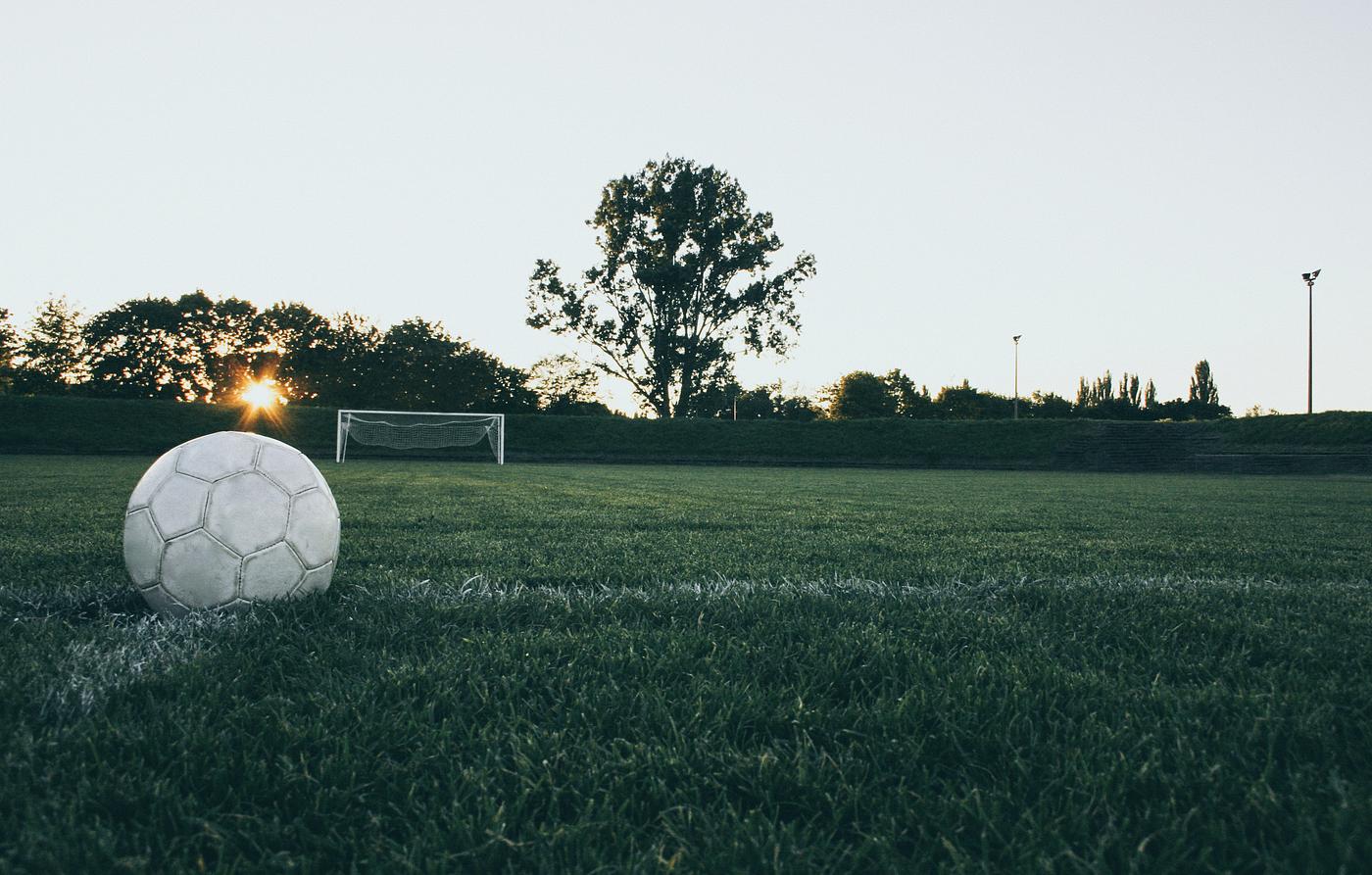 White soccer ball in the field White soccer ball in the field
