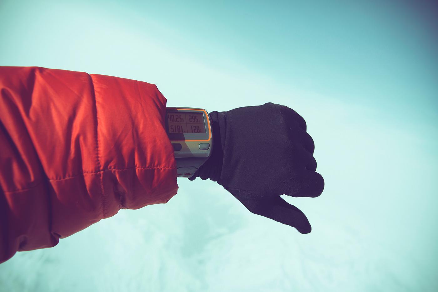 Man in winter clothing wearing an active watch Man in winter clothing wearing an active watch