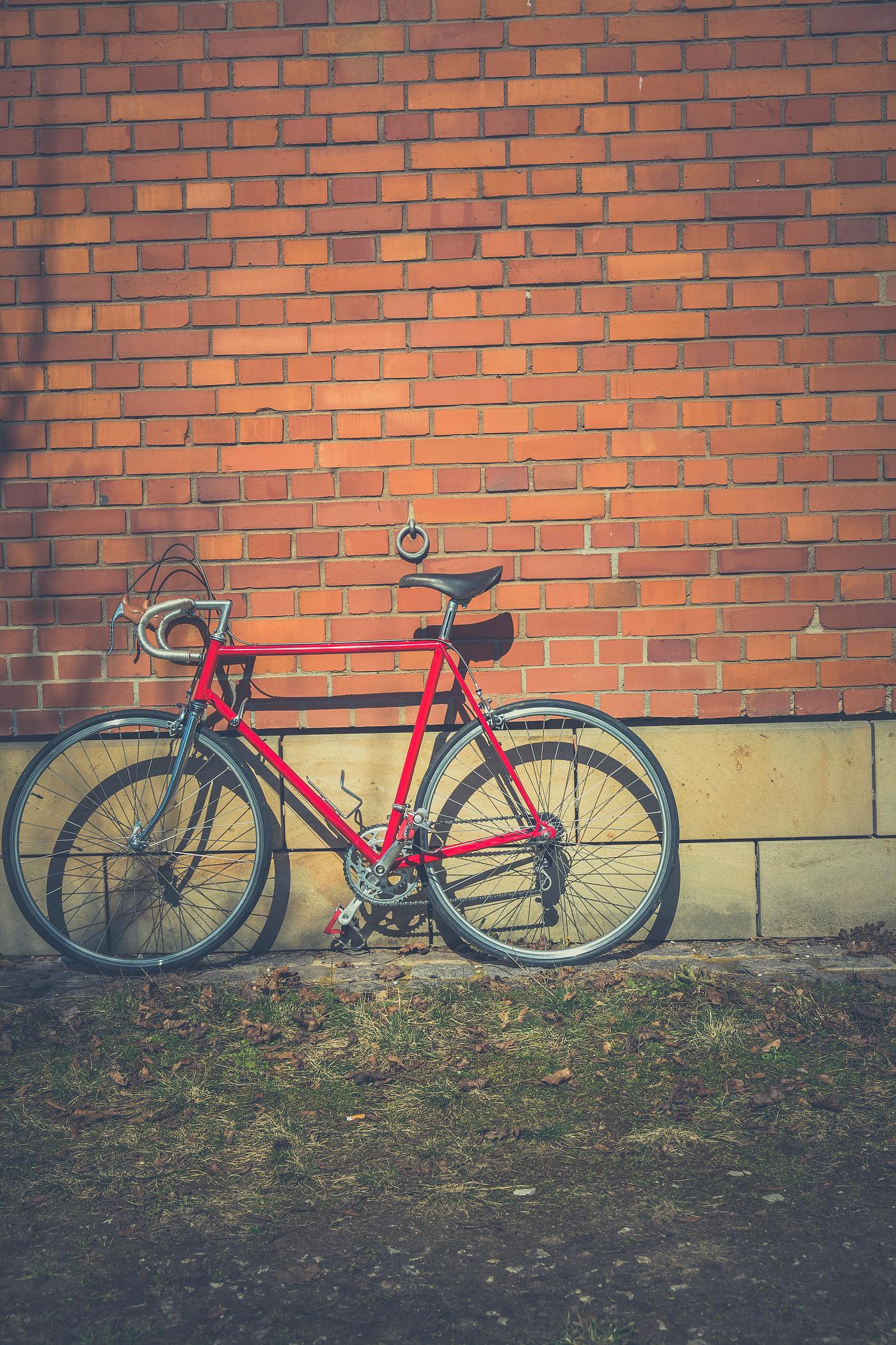 Vintage racing bike against a brick wall Vintage racing bike against a brick wall