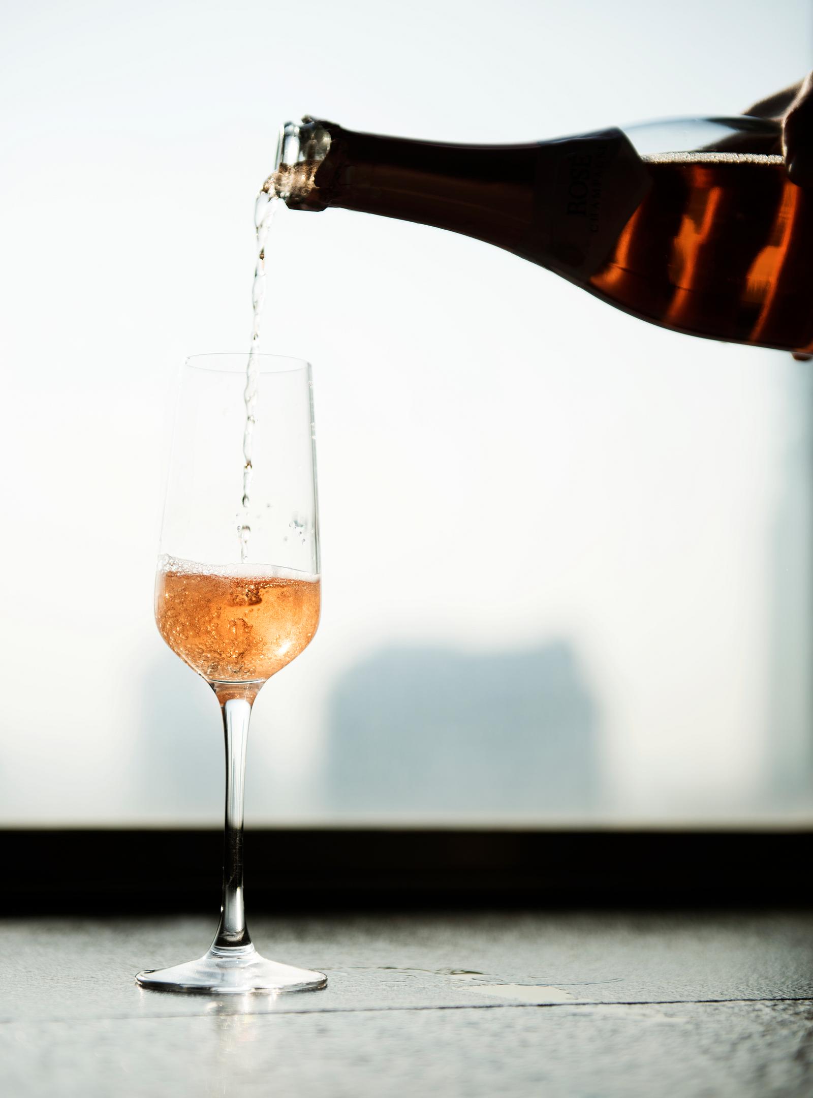 Waiter Poring Serving Red Wine to Customers in a Restaurant Royalty Waiter Poring Serving Red Wine to Customers in a Restaurant Royalty