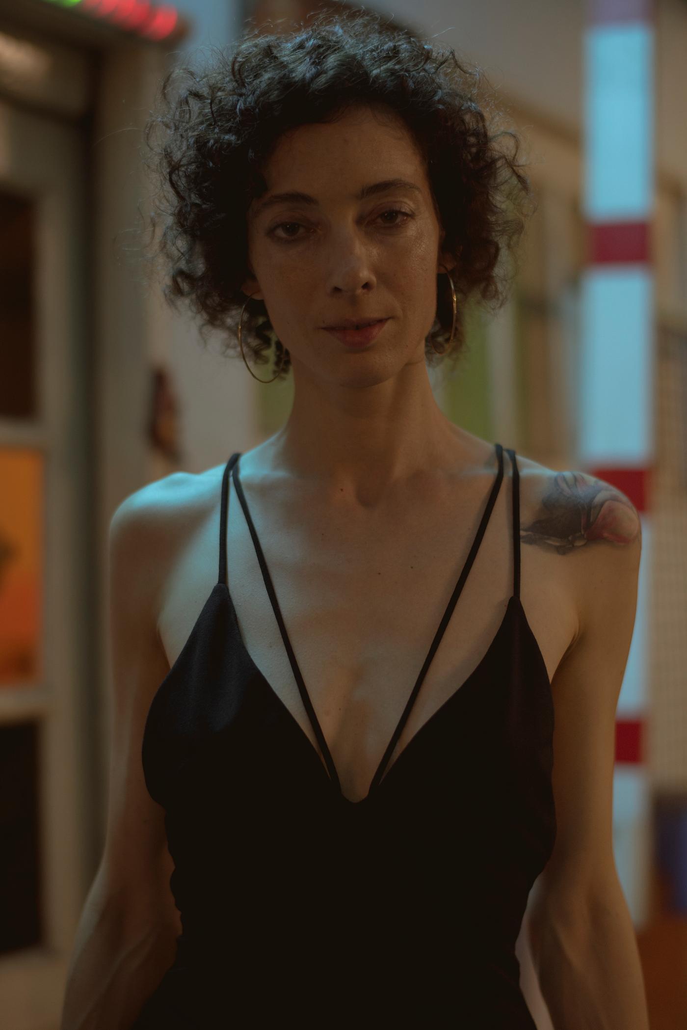 Portrait of a woman in a dark bar - alone, bar, club, clubbing, curly hair, dark, lifestyle, night, night life, night out,... Portrait of a woman in a dark bar - alone, bar, club, clubbing, curly hair, dark, lifestyle, night, night life, night out,...