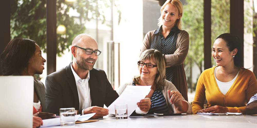 People in a meeting at a table 