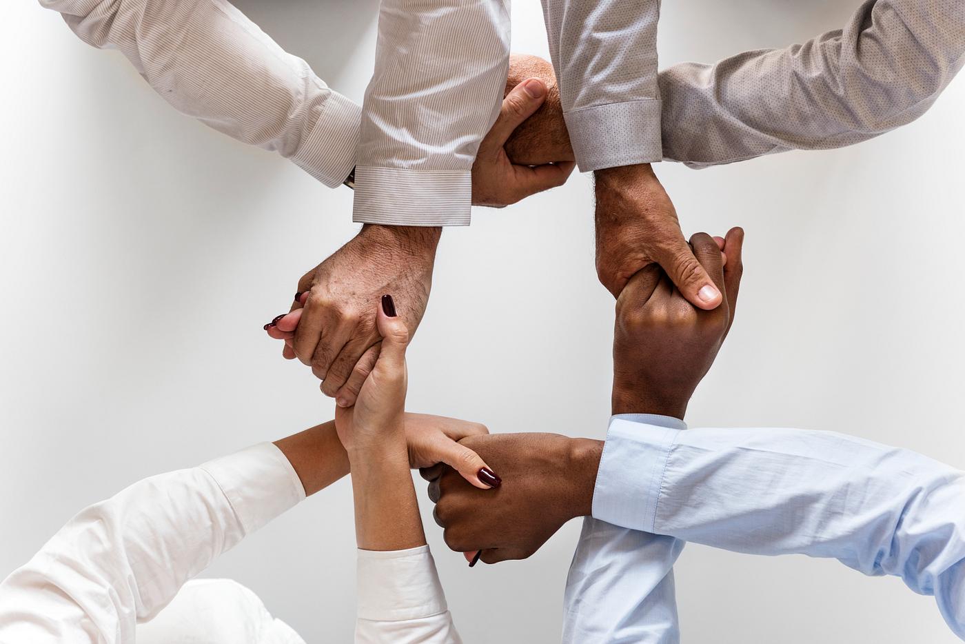 Business hands joined together teamwork Business hands joined together teamwork