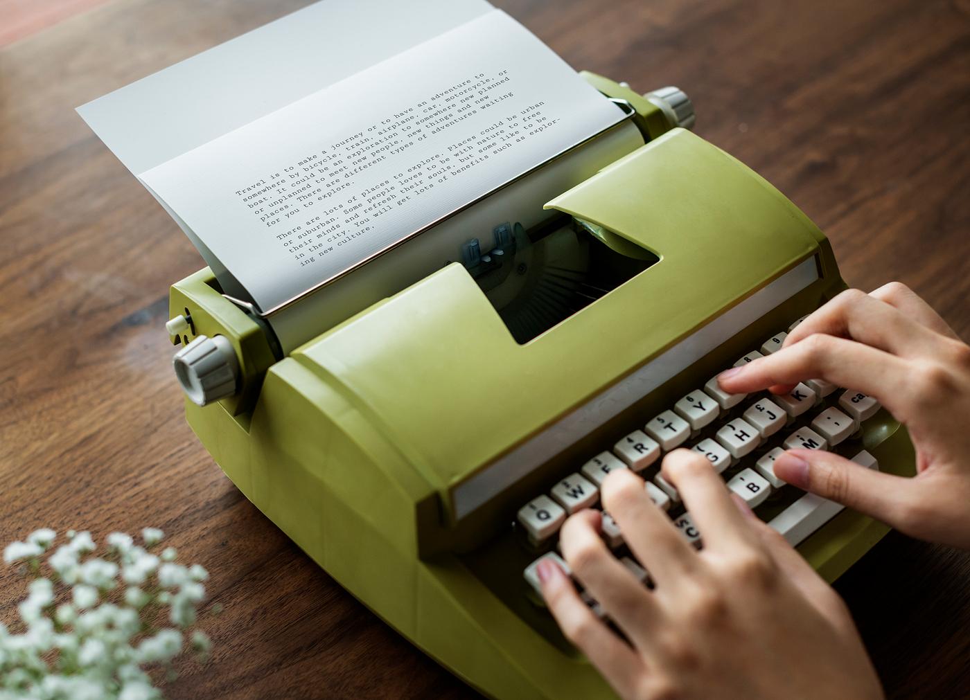 Aerial view a woman using a retro typewriter Aerial view a woman using a retro typewriter