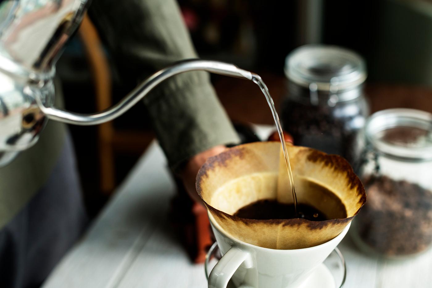 Aerial view of a person making drip coffee Aerial view of a person making drip coffee