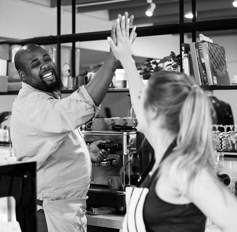 8 Ways To Deliver Outstanding Customer Service In Restaurants 2 Colleagues give a high five to each other