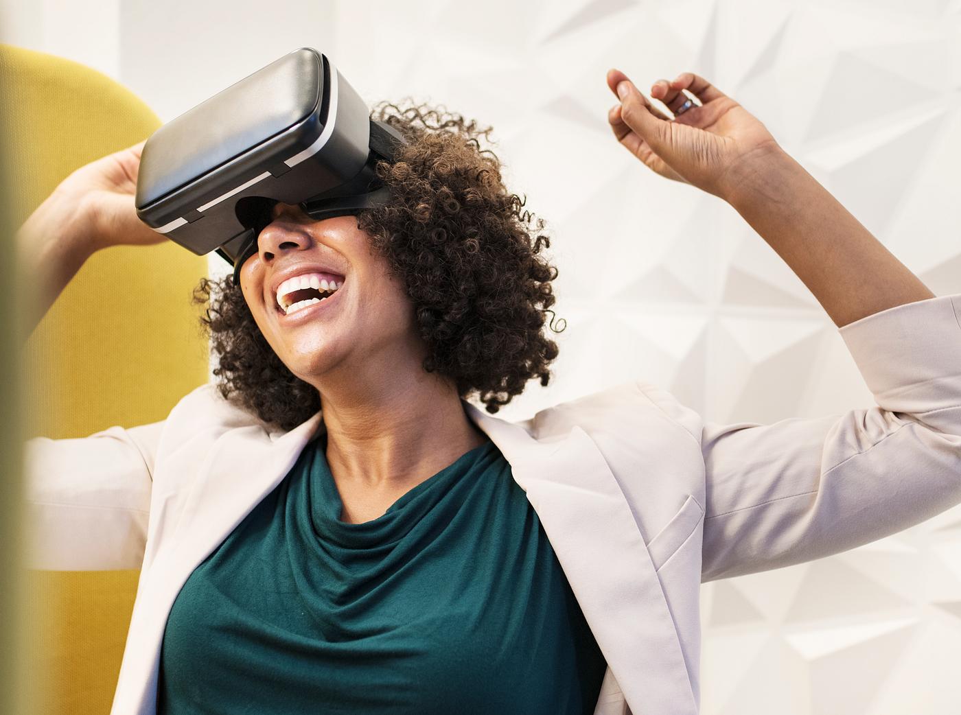 Woman having fun with a VR set Woman having fun with a VR set