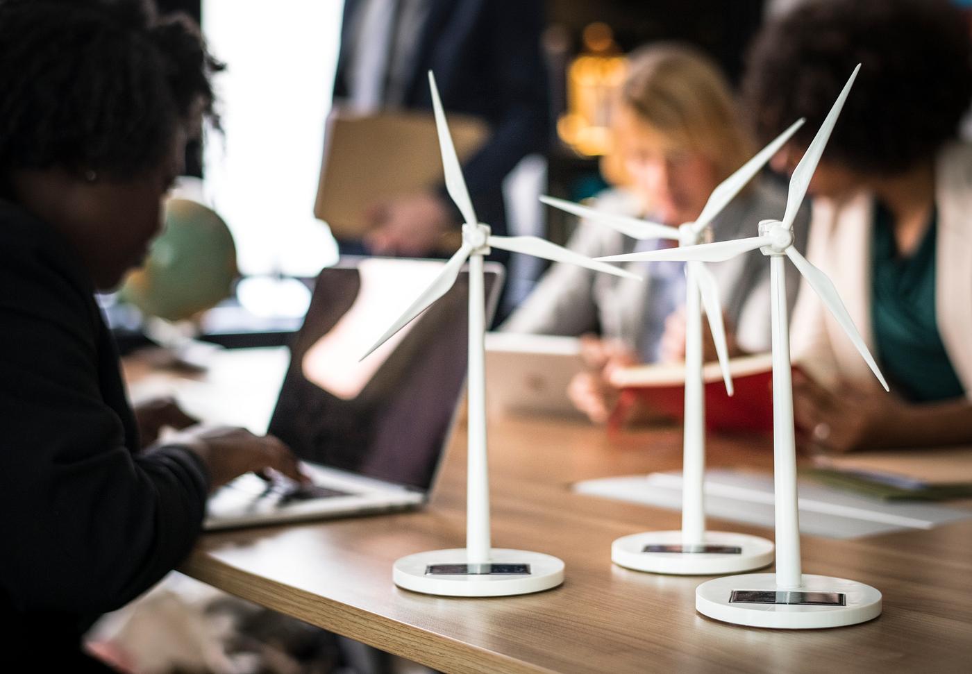 Windmill models on a meeting table Windmill models on a meeting table