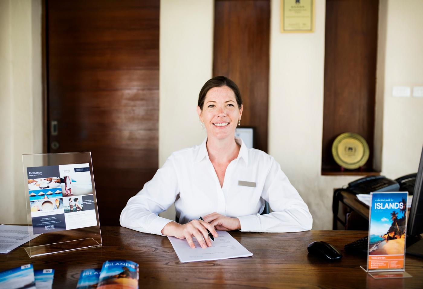 Female Receptionist Working At The Front Desk Royalty Free Photo