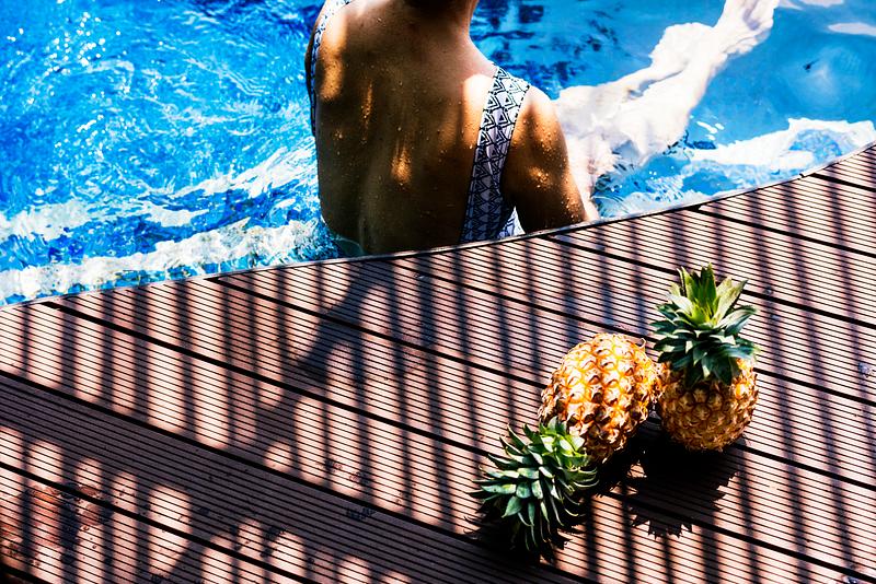 Woman relaxing in a swimming pool Woman relaxing in a swimming pool