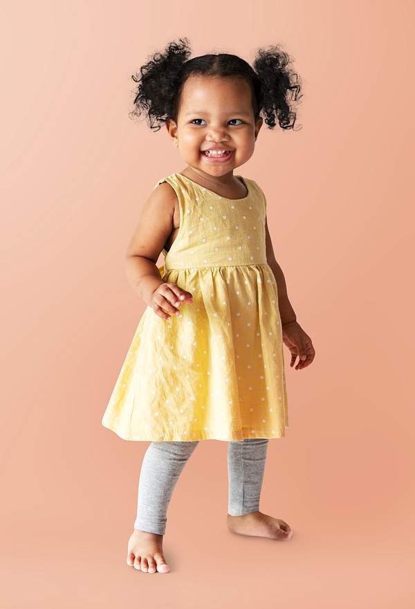 Happy Little Girl In A Yellow Dress Standing Royalty Free Psd Mockup 536111