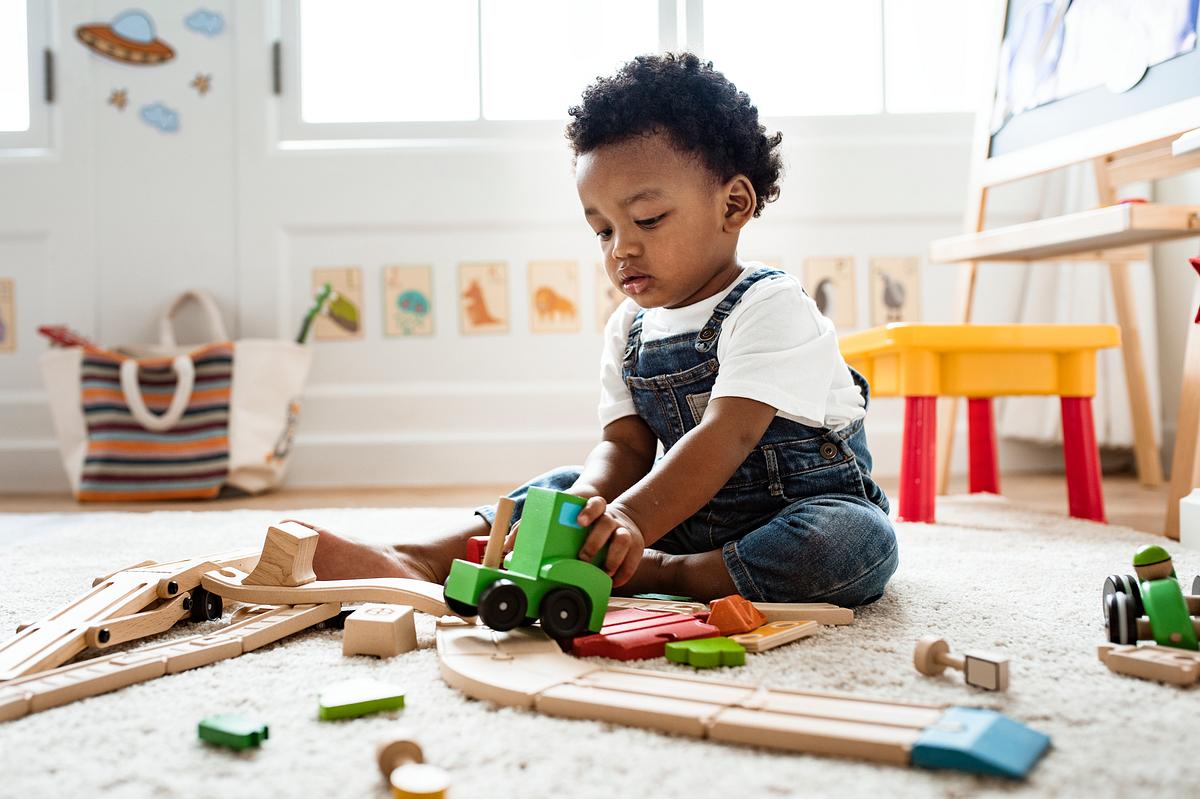 Little boy having fun and playing wooden toy drum Royalty free photo Little boy having fun and playing wooden toy drum Royalty free photo