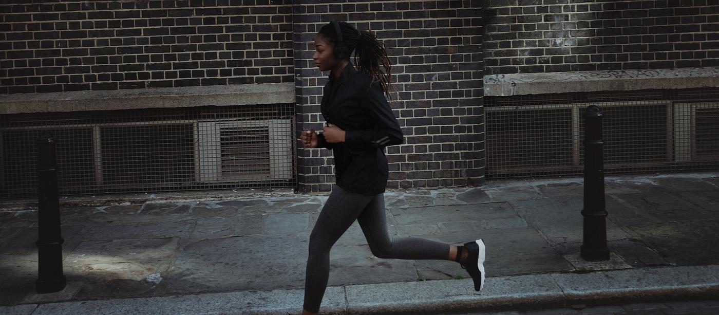 Woman jogging through the city Woman jogging through the city