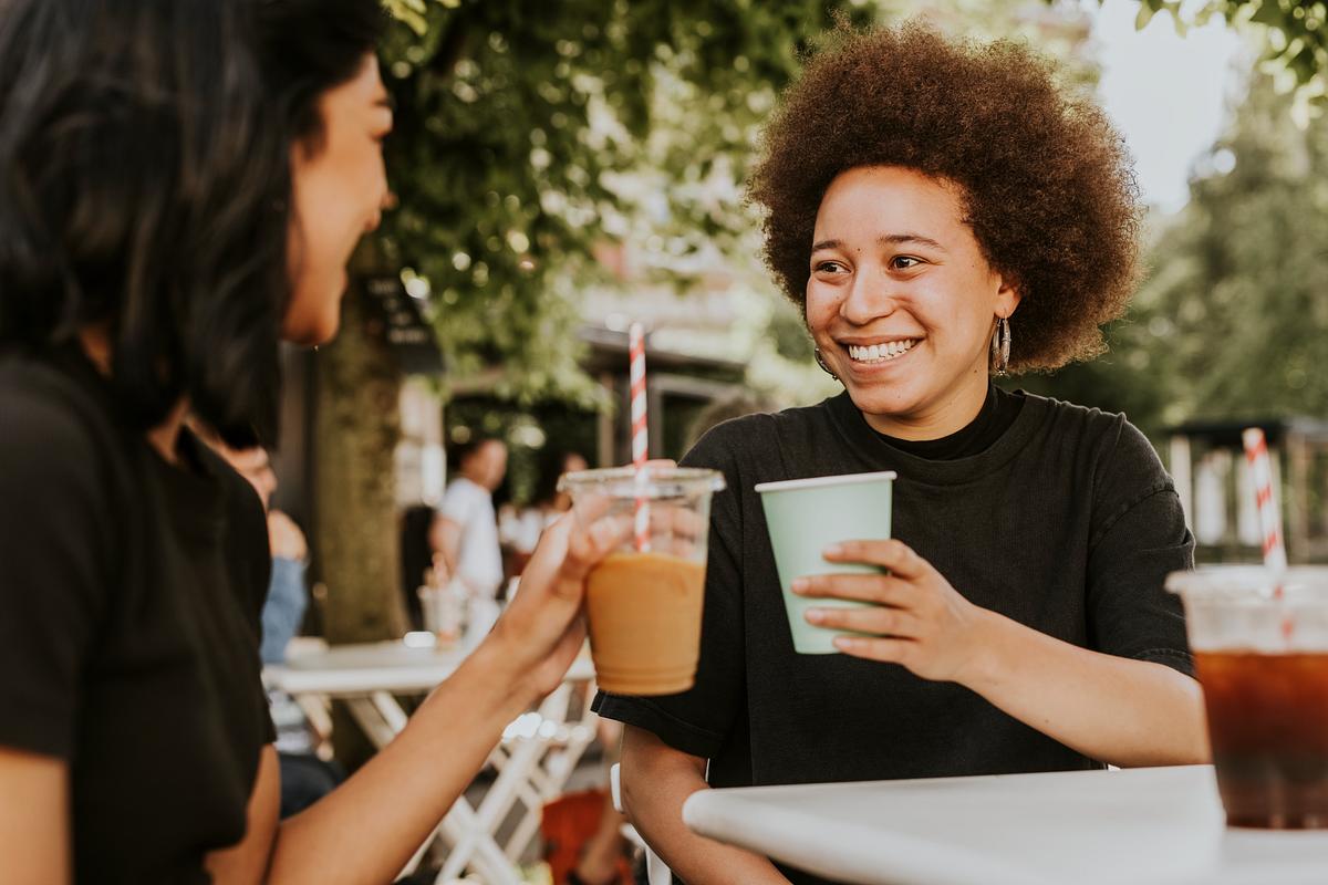 A group of friends discussing relationships over coffee