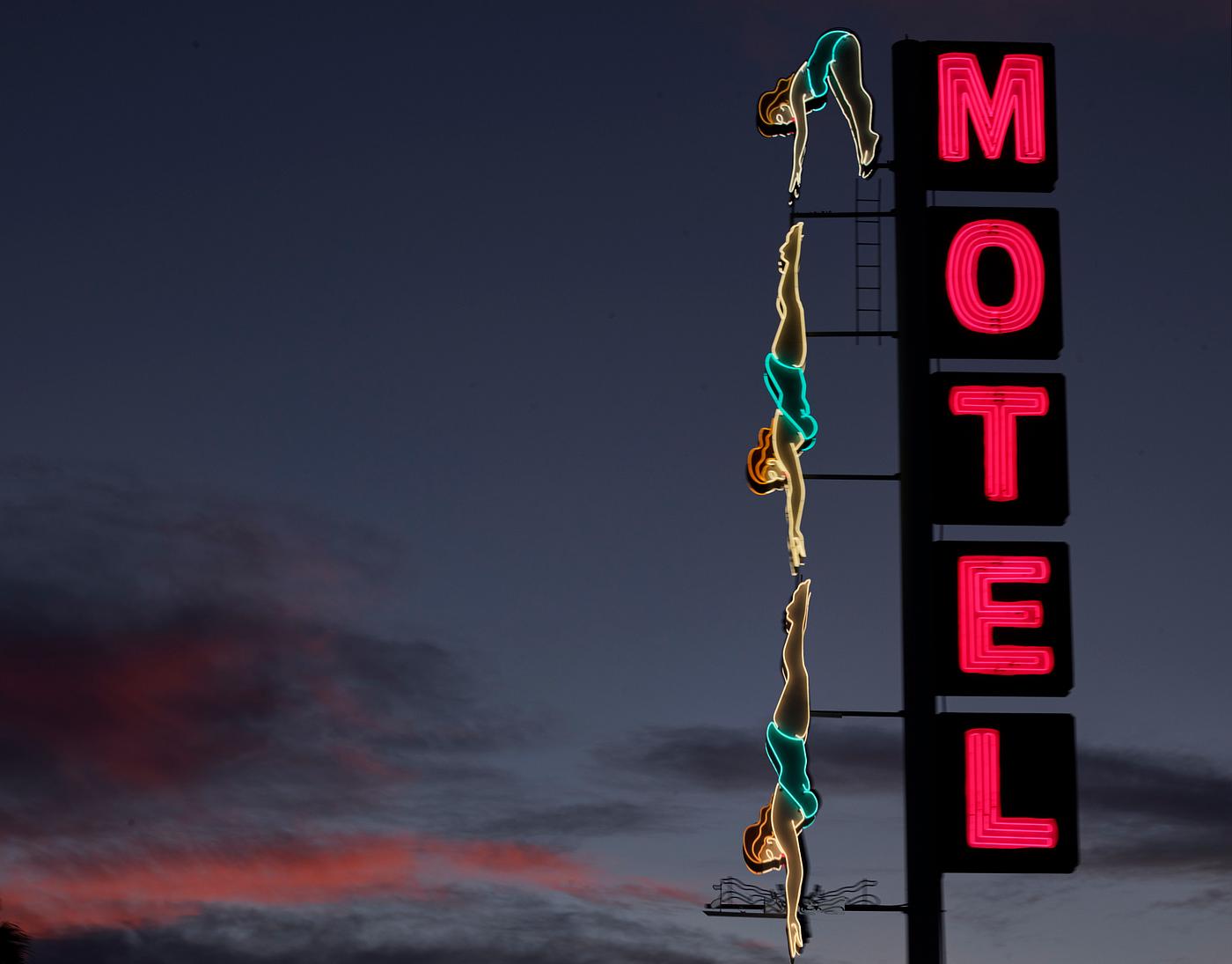 Creative "diver" neon sign at the old Starlight Motel in Mesa, a small Arizona city that became one of sprawling... Creative "diver" neon sign at the old Starlight Motel in Mesa, a small Arizona city that became one of sprawling...