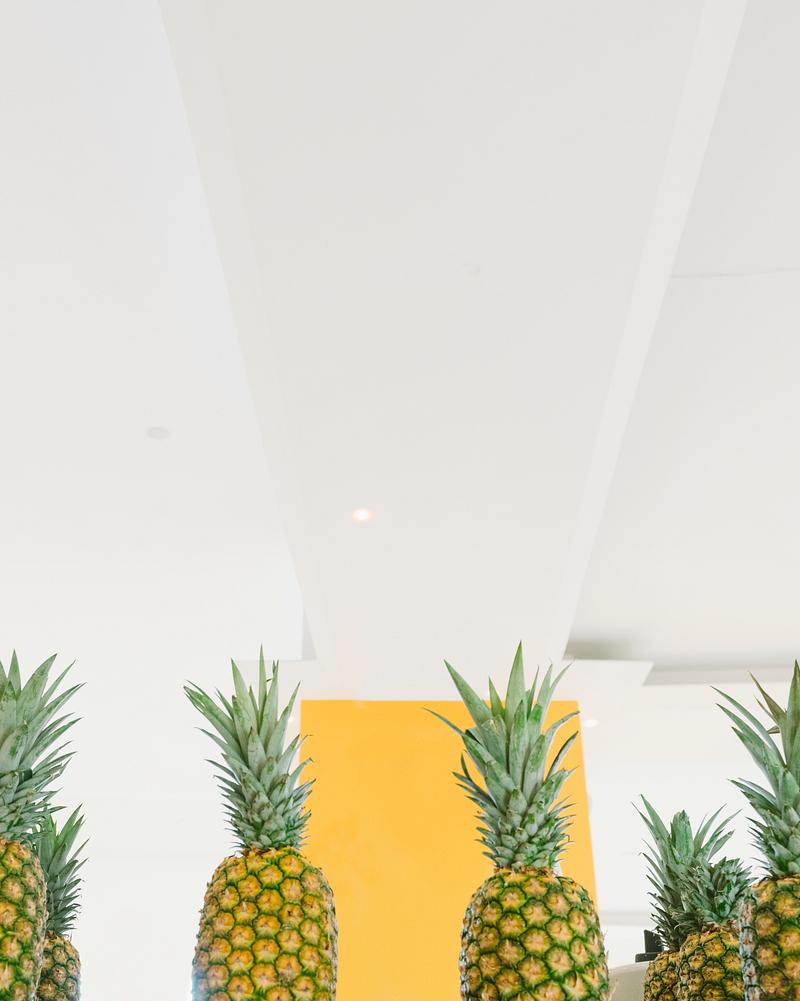 Pineapples in a row studio shot Tropical pineapples in a studio