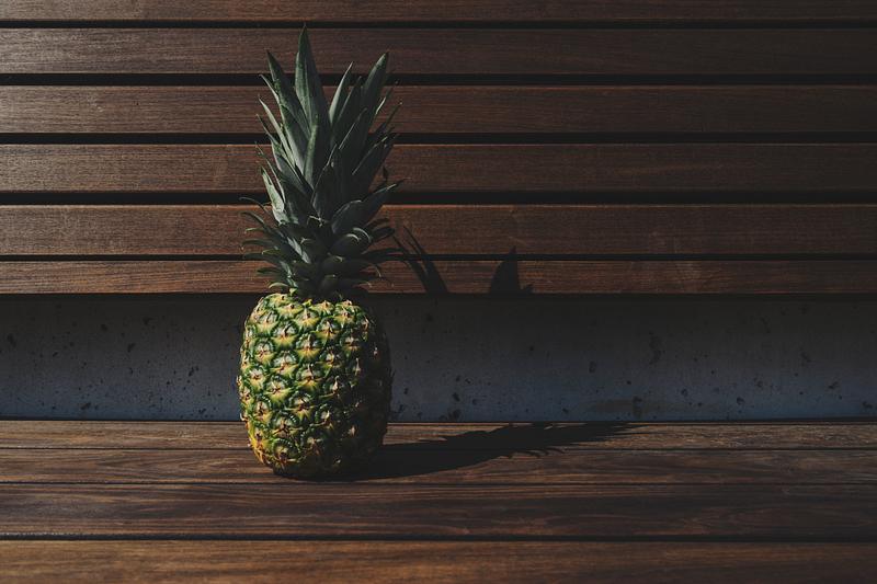 Tropical pineapple on a wooden deck Tropical pineapple on a wooden deck
