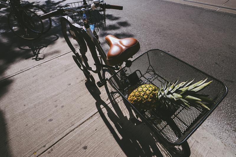 Pineapple in a bicycle basket Pineapple in a bicycle basket