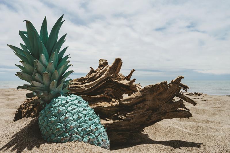Colorful pineapple on a beach Colorful pineapple on a beach