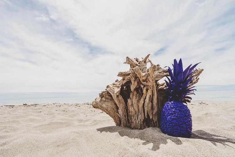 Colorful pineapple on a beach Colorful pineapple on a beach
