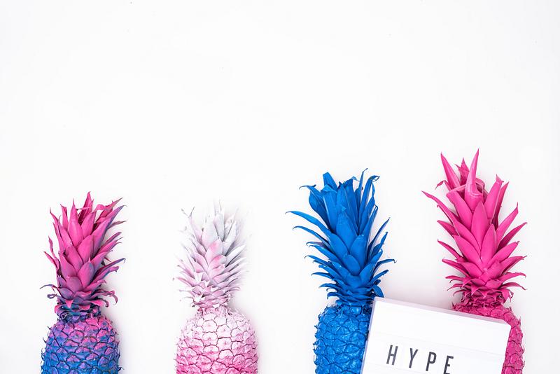 Bright colorful pineapples in a row Bright colorful pineapples in a row