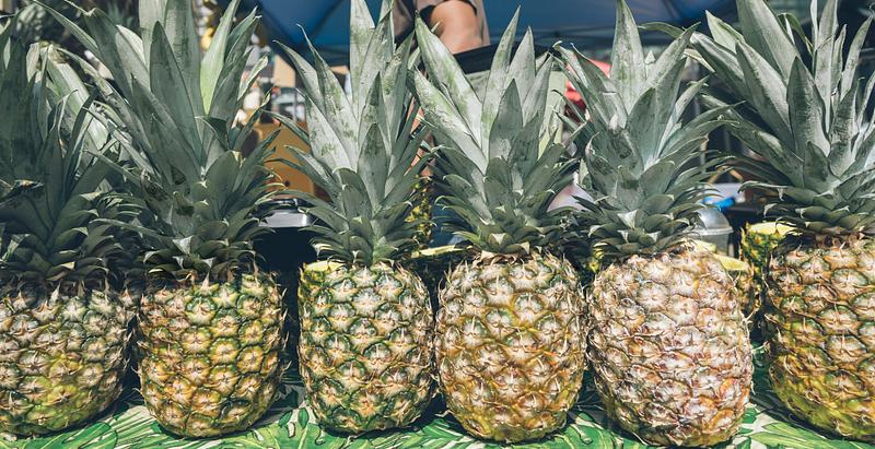 Tropical pineapples in a market Tropical pineapples in a market