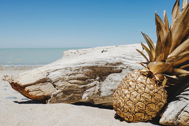 Golden pineapple on a beach Golden pineapple on a beach
