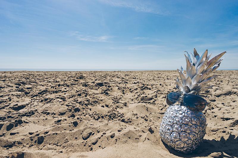 Silver pineapple on a beach Silver pineapple on a beach
