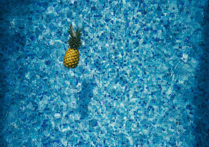 Tropical pineapple in a swimming pool Tropical pineapple in a swimming pool