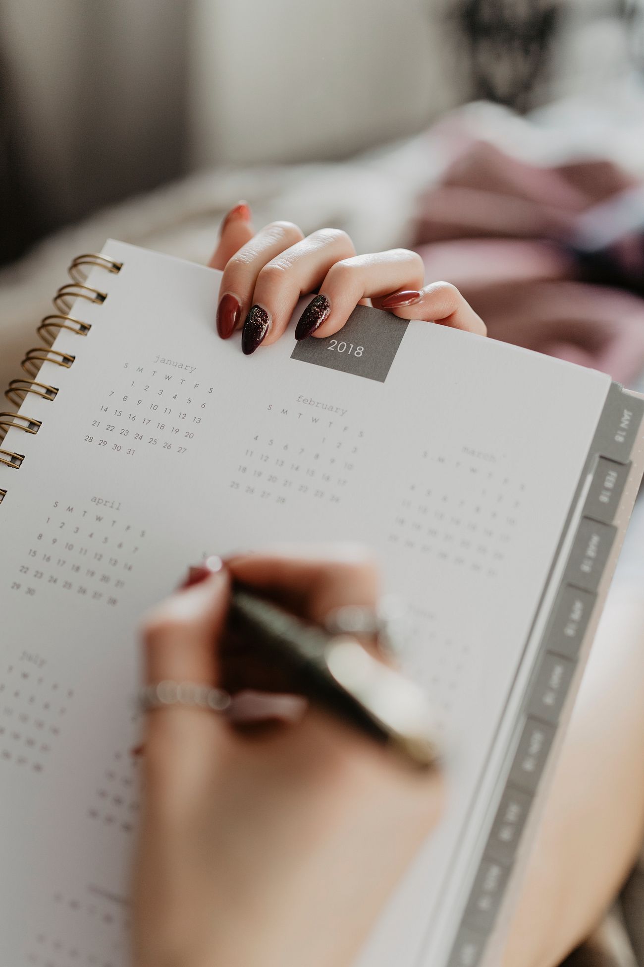 Woman writing on a calendar. Free Photo rawpixel
