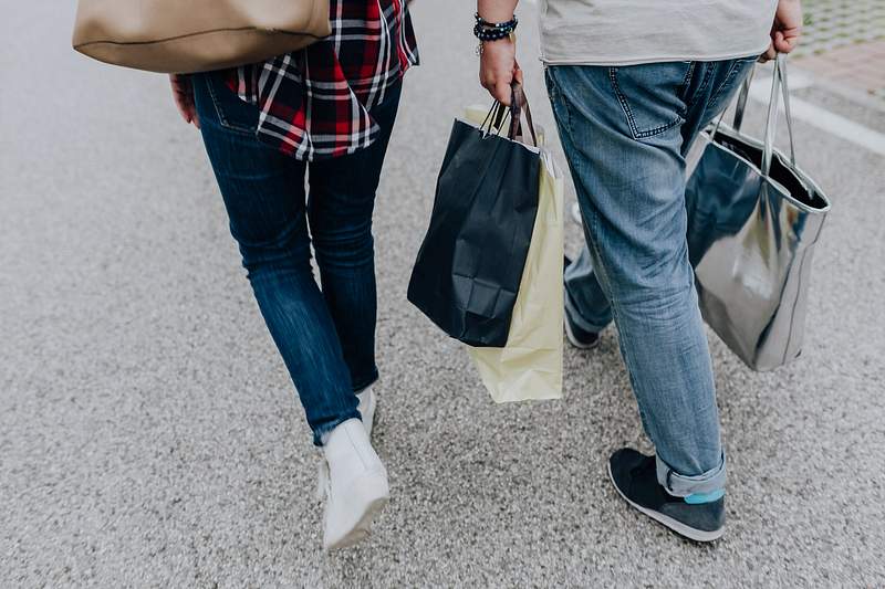 Couple walking with shopping bags. Visit Kaboompics for more free images. 