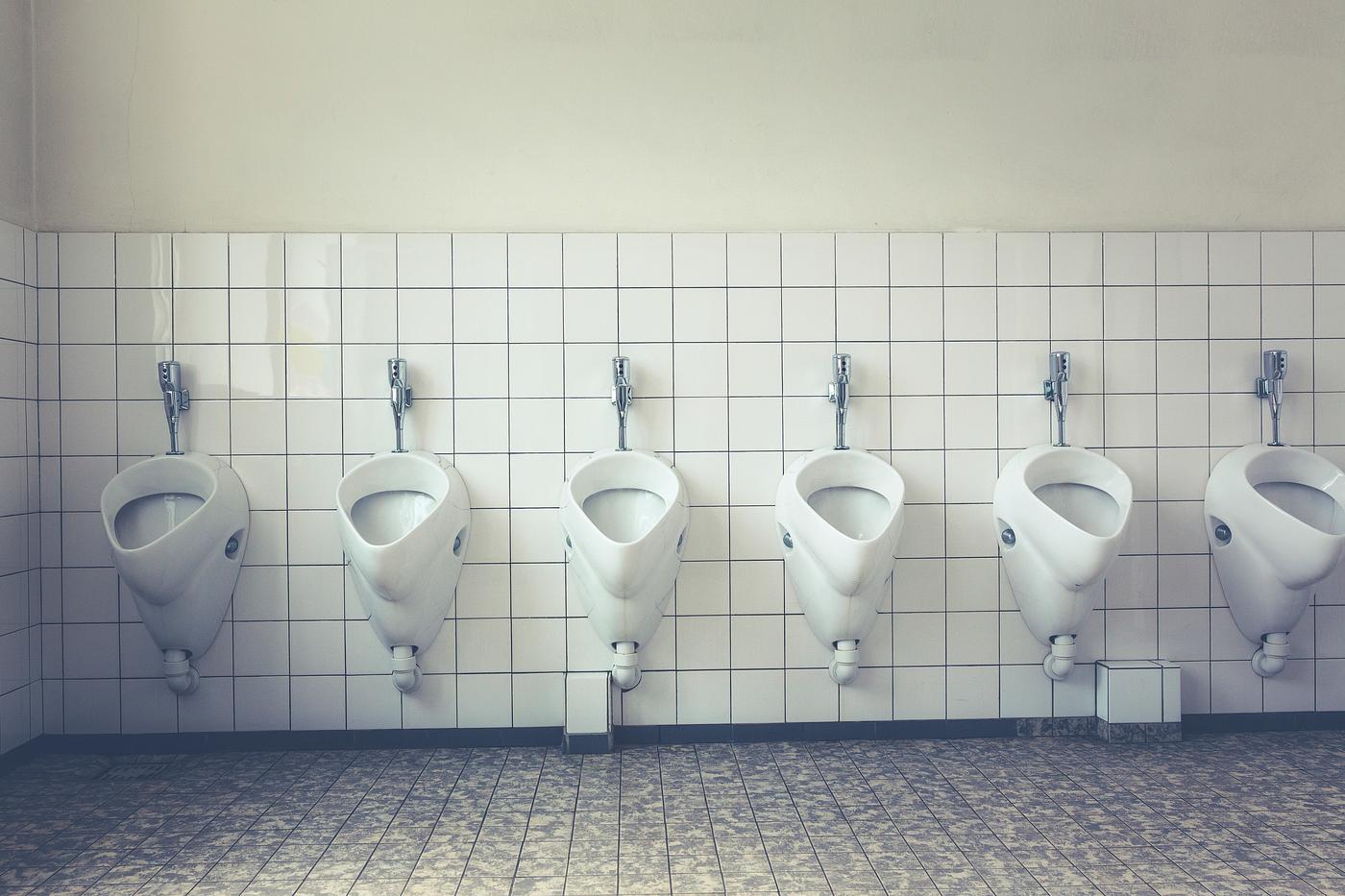 Urinals in a men restroom Urinals in a men restroom