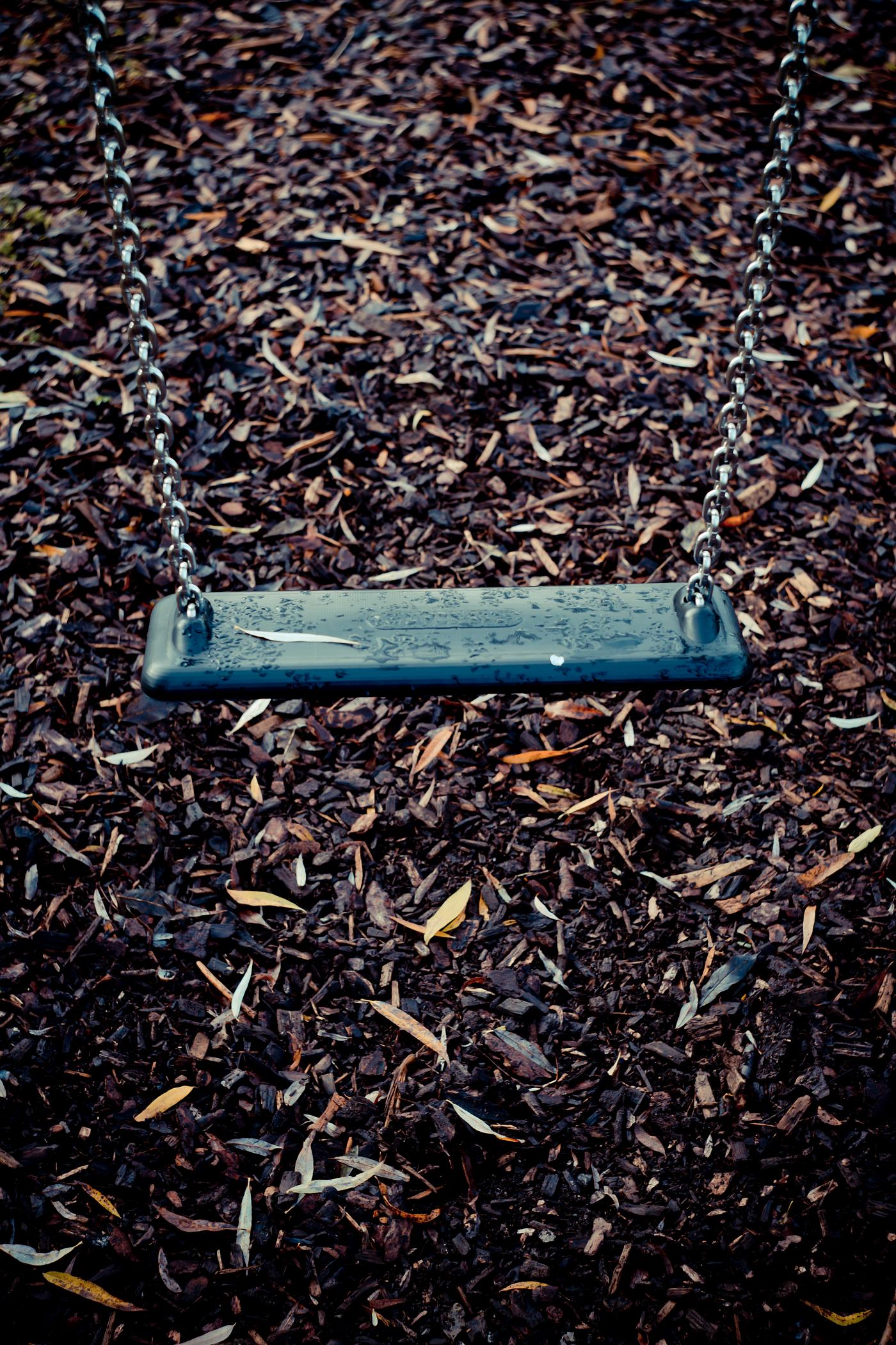 A swing at a playground A swing at a playground