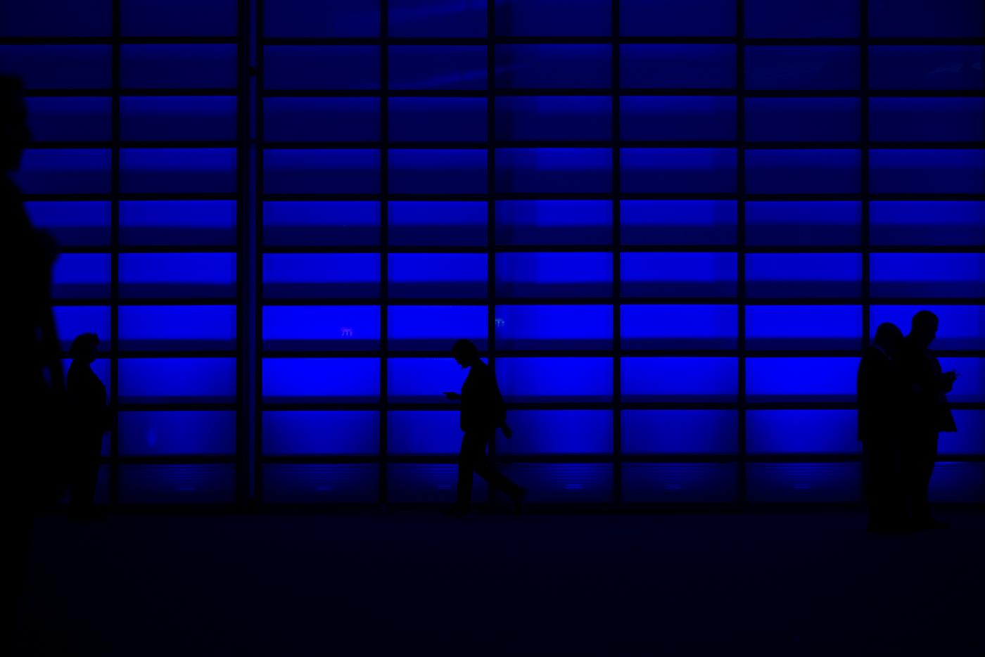 Watching silhouette people walking via a blinder Watching silhouette people walking via a blinder