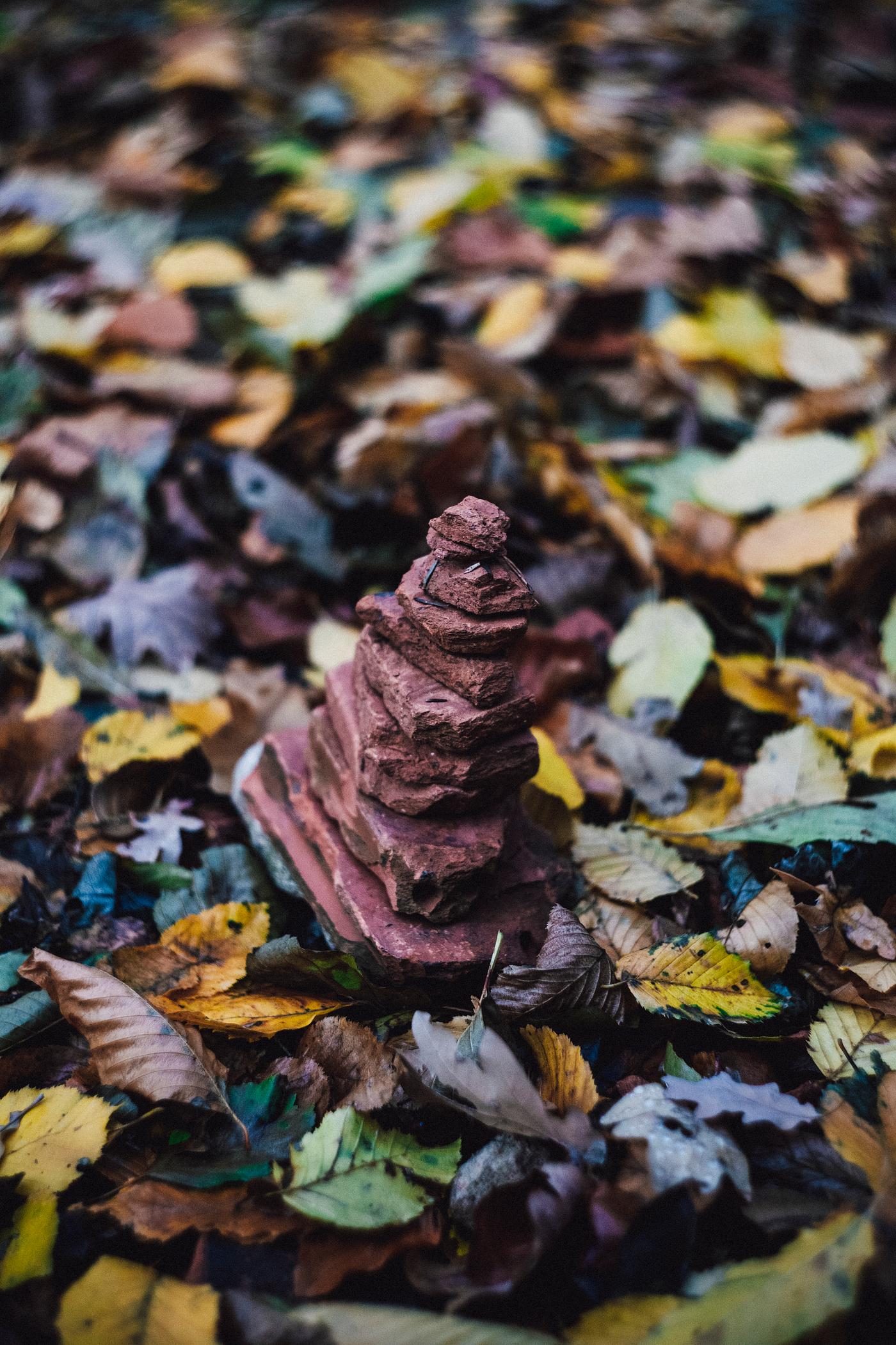 Stack of stones on leaves Stack of stones on leaves