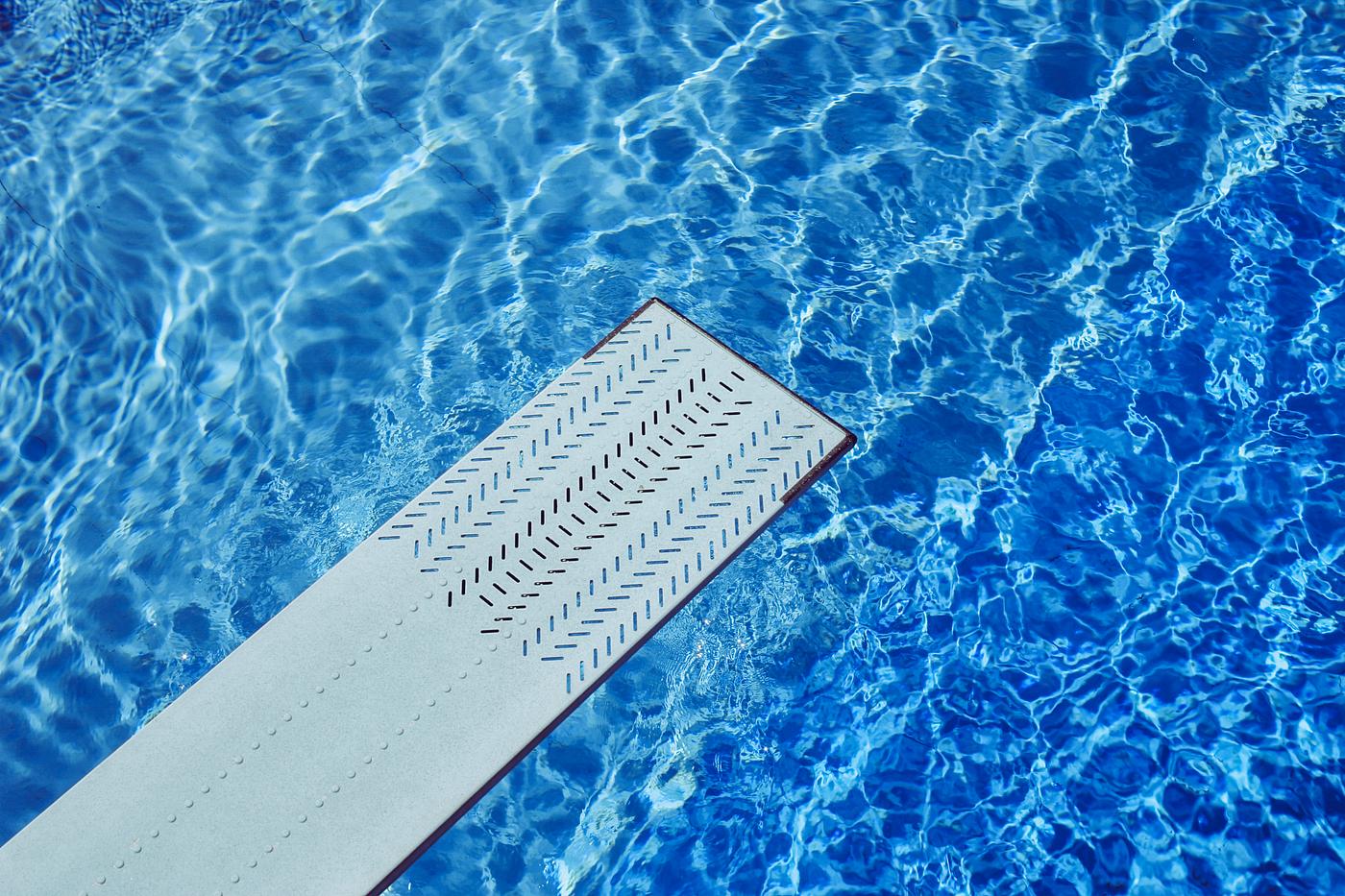 Spring board over a swimming pool Spring board over a swimming pool
