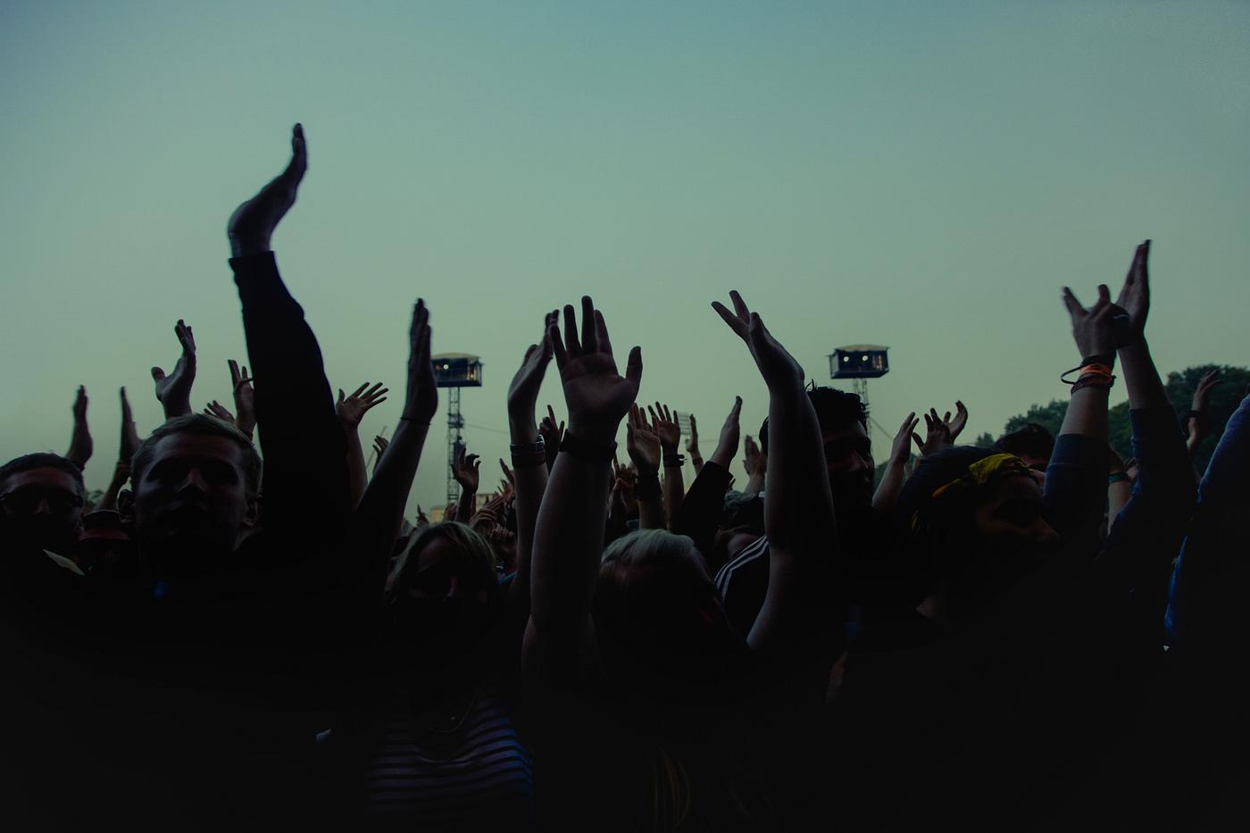 People enjoying at a festival People enjoying at a festival