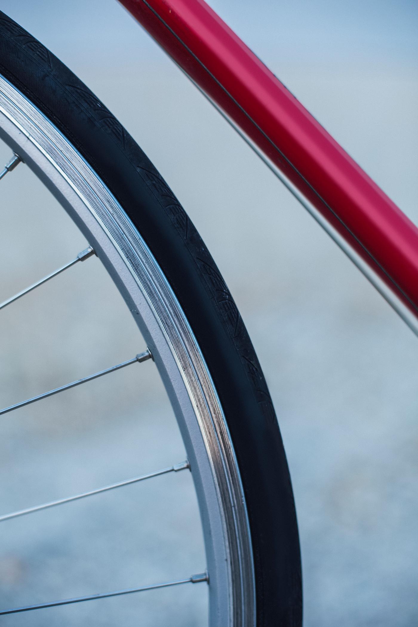 Red frame of a city bike Red frame of a city bike