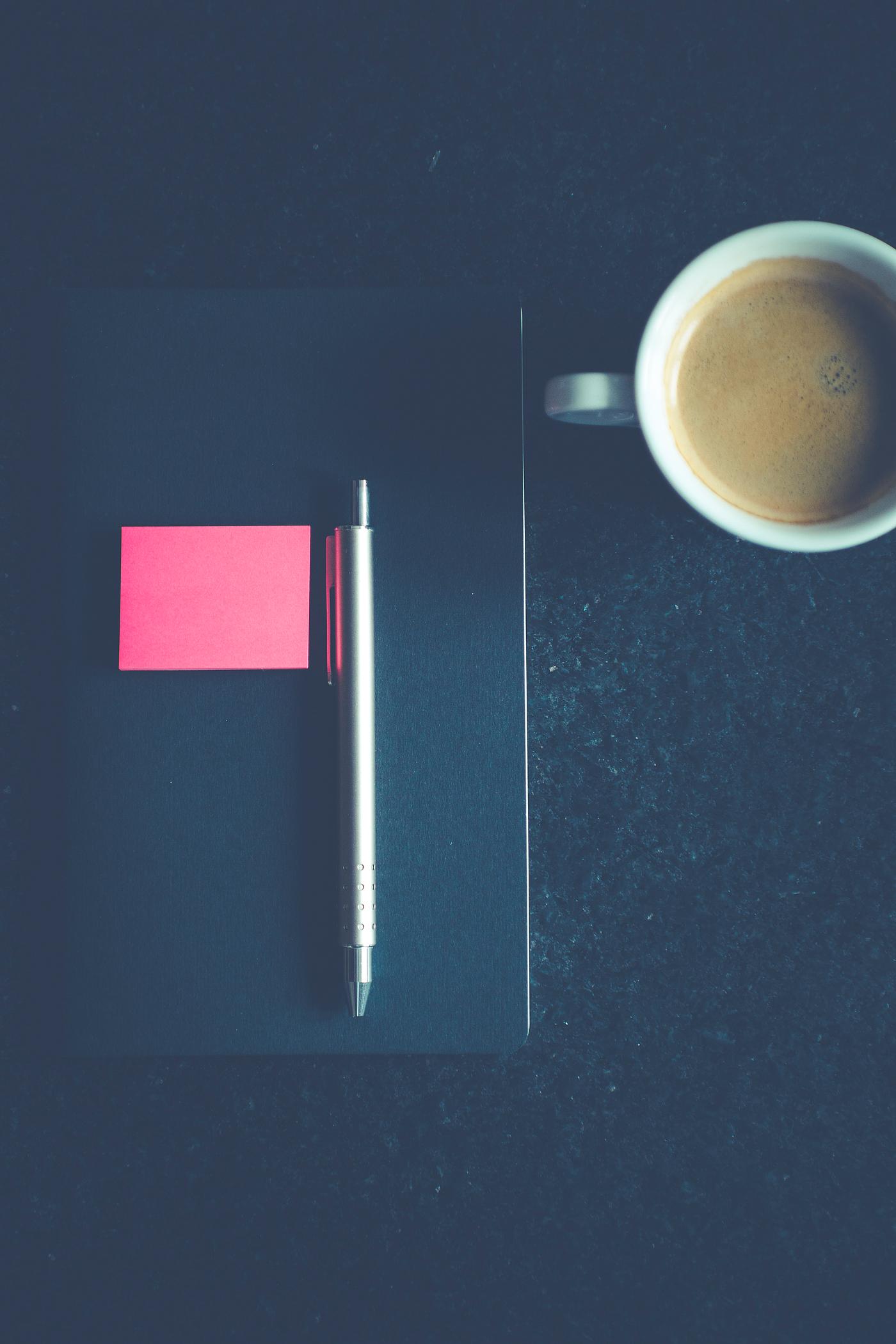 Notebook on a table with a cup of coffee Notebook on a table with a cup of coffee