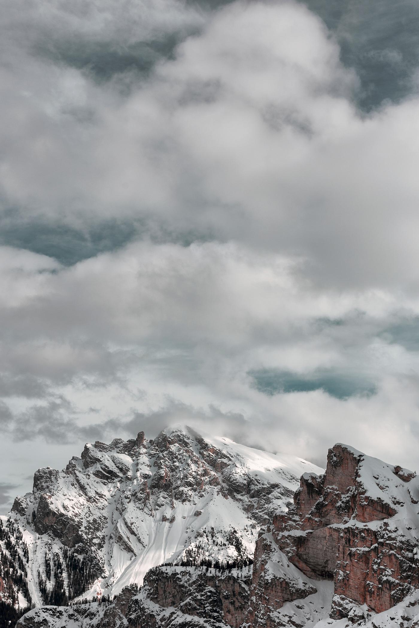 The snow atop the foggy summit of the Dolomites The snow atop the foggy summit of the Dolomites