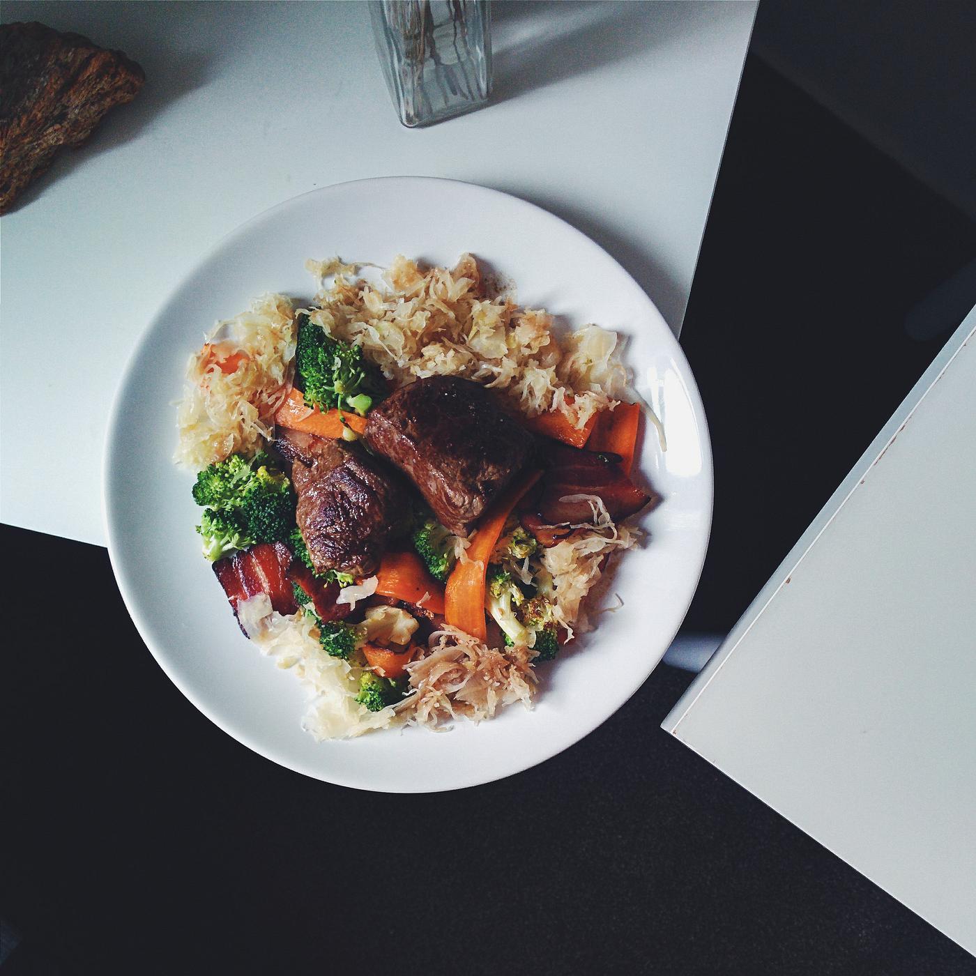 Paleo beef steak with vegetables on a bed of cabbage Paleo beef steak with vegetables on a bed of cabbage