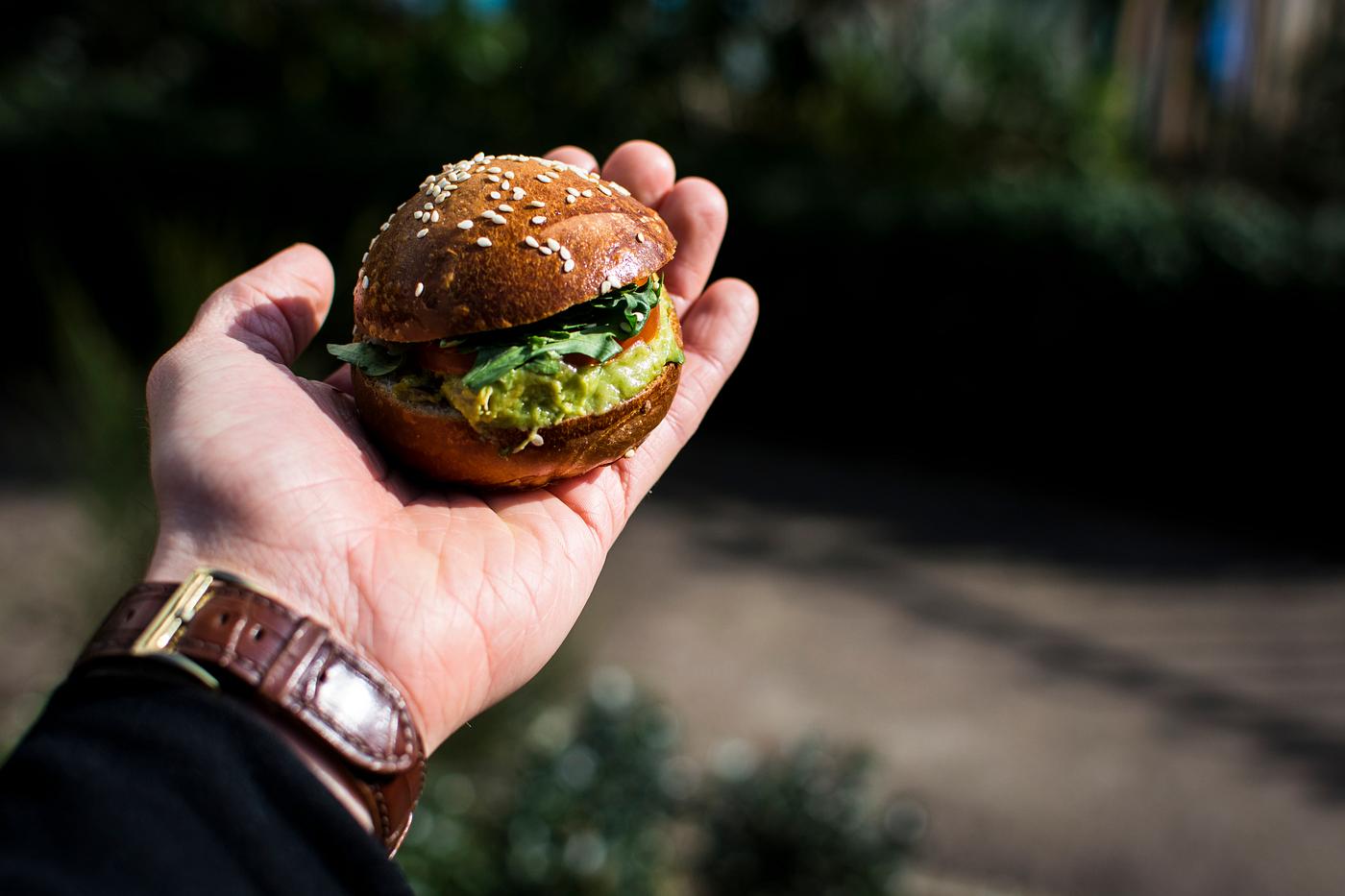 Mini guacamole burger on hand Mini guacamole burger on hand