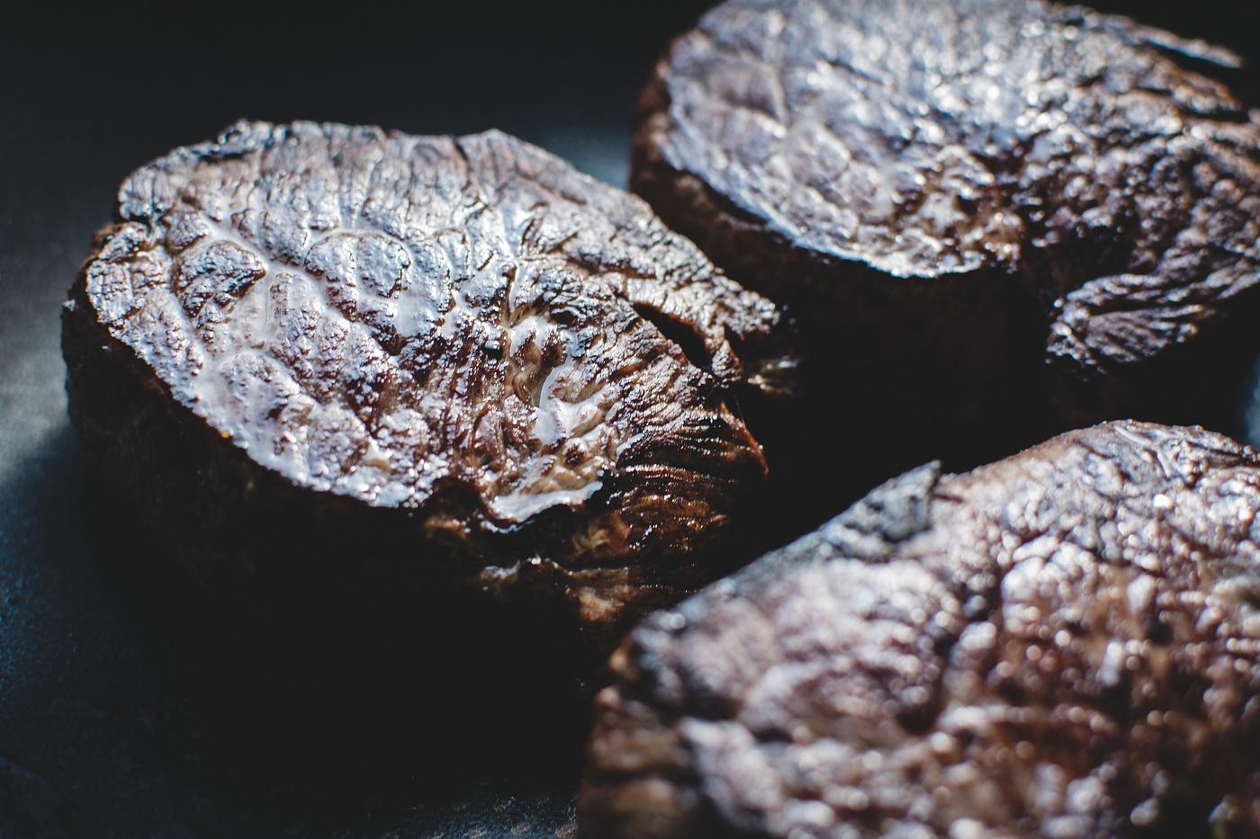 A cooked beef steak closeup A cooked beef steak closeup