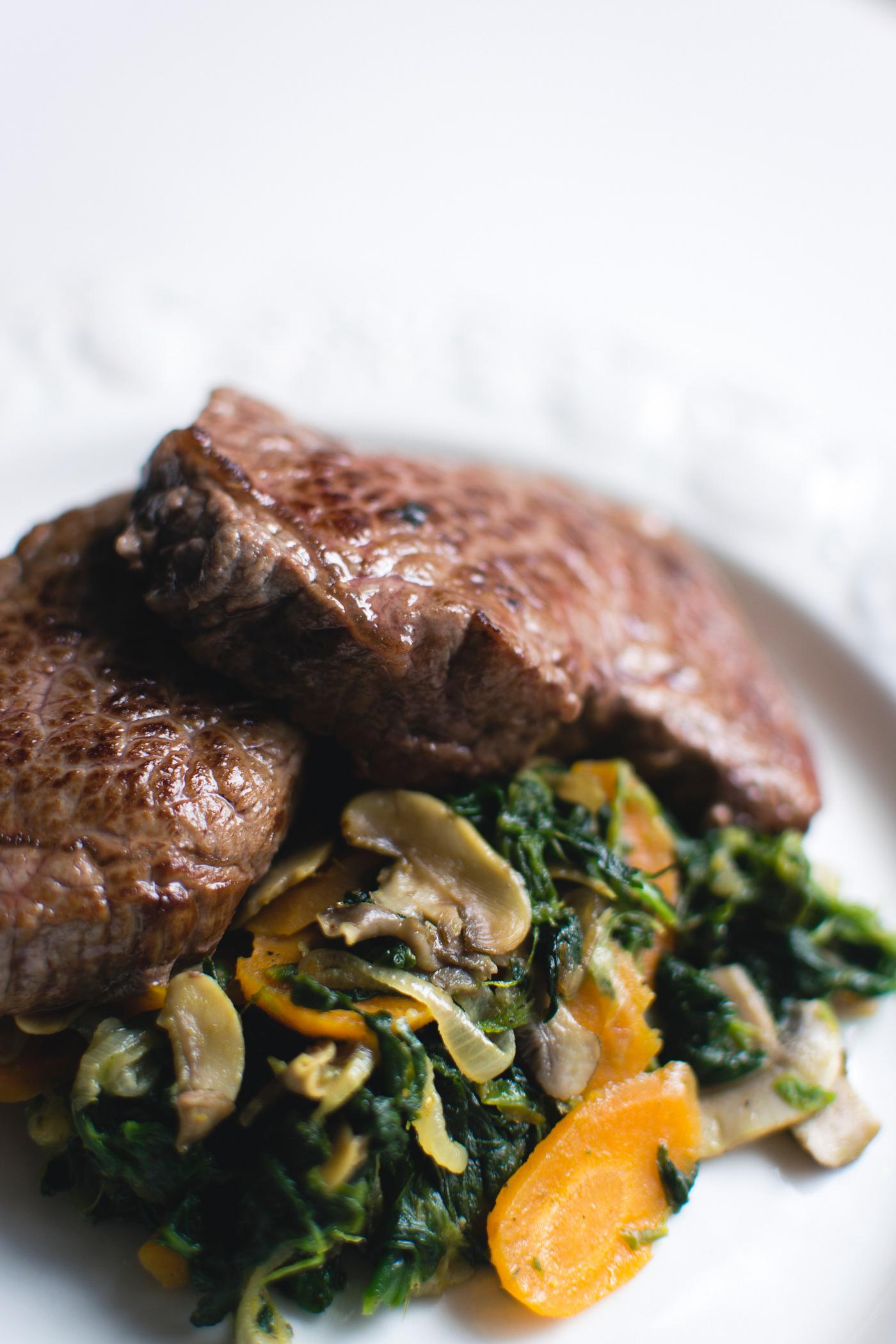 A beef steak and vegetables A beef steak and vegetables