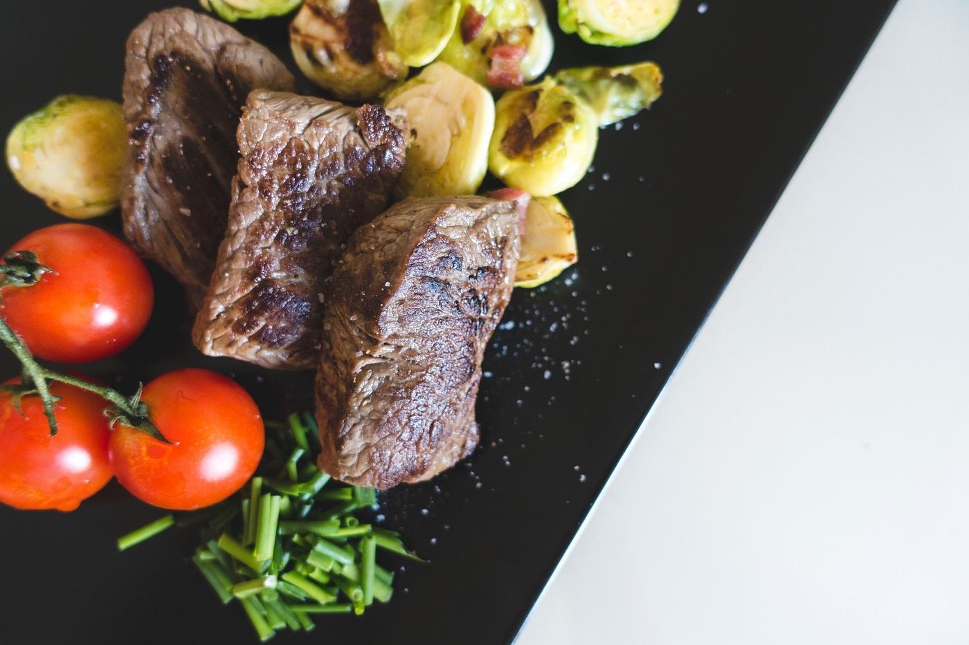 A beef steaks with vegetables A beef steaks with vegetables