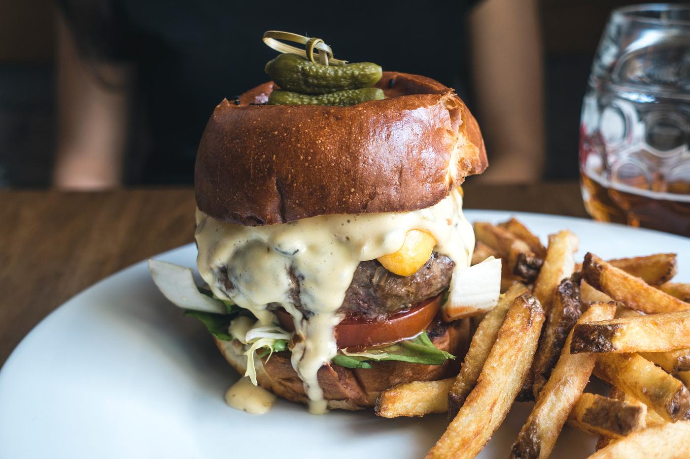 Burger with tiny pickled on food photography Burger with tiny pickled on food photography