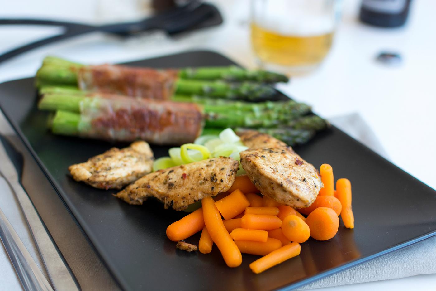 Chicken breast steak with vegetables and a glass of beer Chicken breast steak with vegetables and a glass of beer