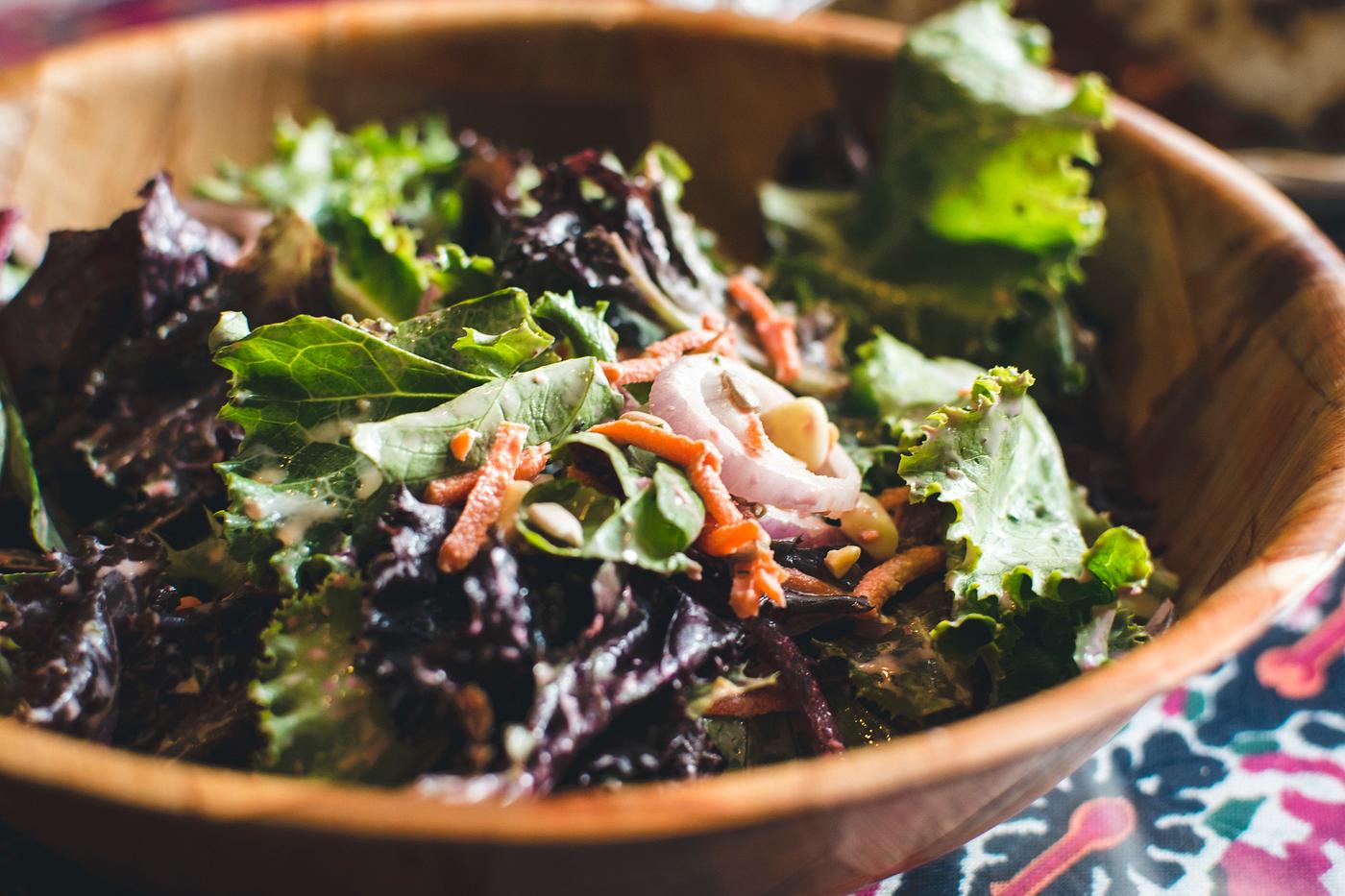 Green salad in a wooden bowl Green salad in a wooden bowl